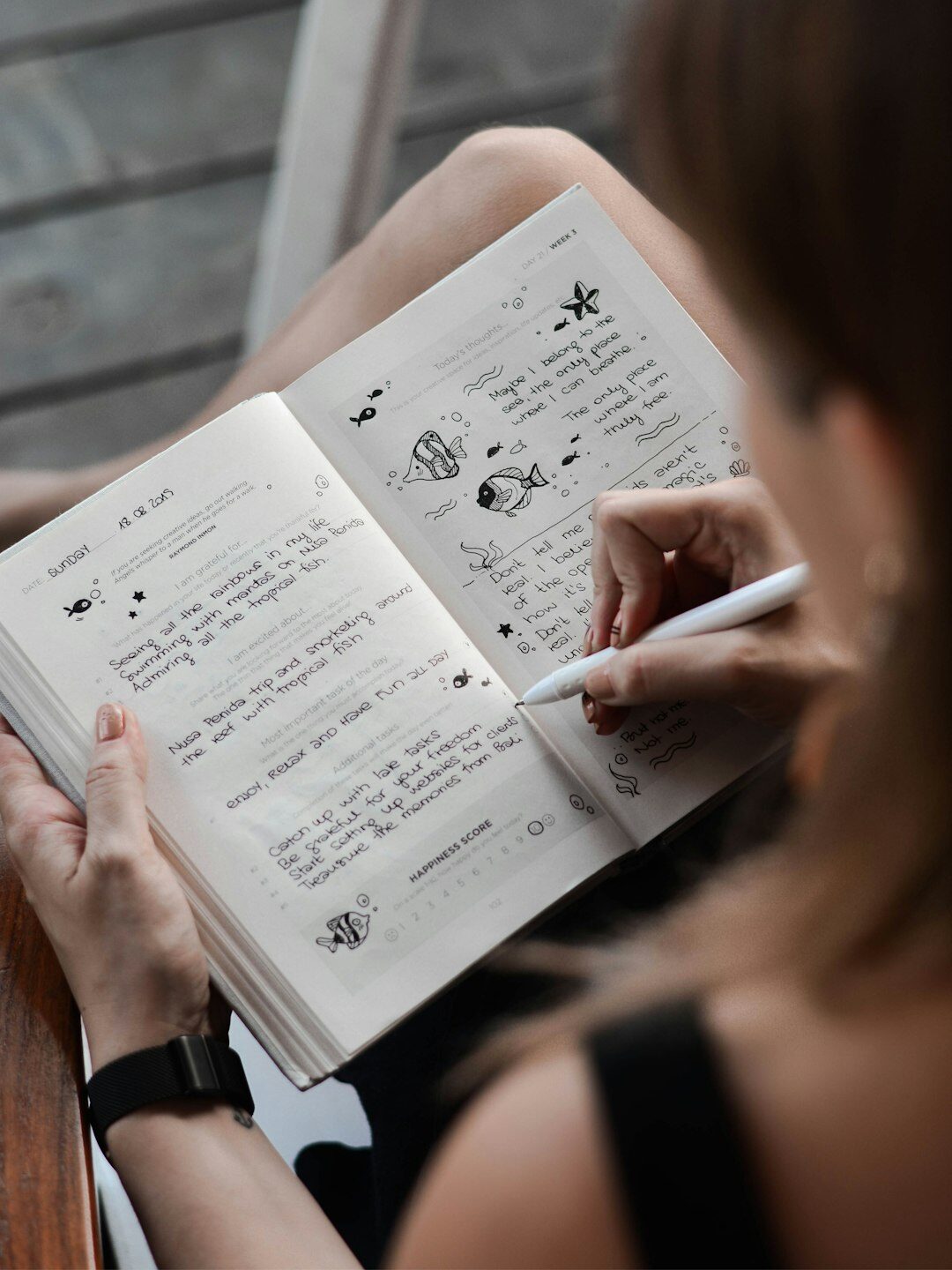 person journaling emotions