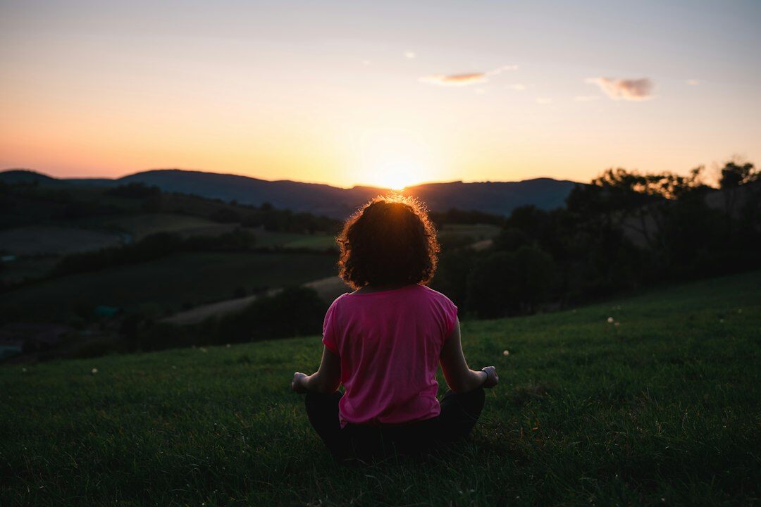 person meditating daily