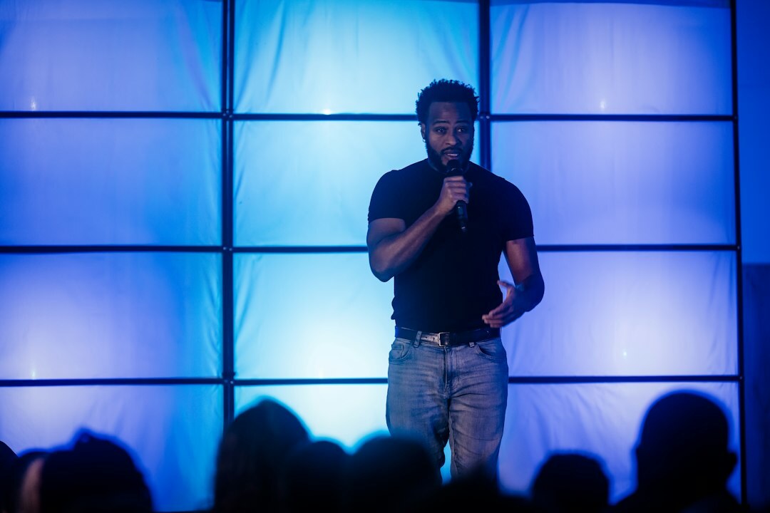 confident speaker on stage